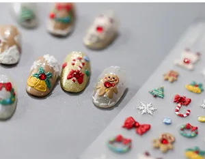 Detailed 5D Christmas nail art stickers featuring 3D gingerbread man and snowflakes