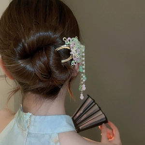 Detail of floral enamel hair stick with pearl tassels for traditional Hanfu attire