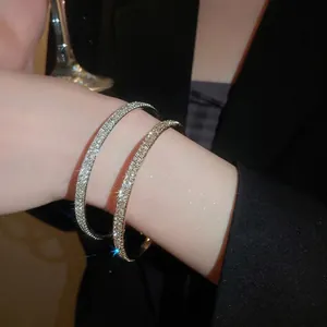Elegant gold and silver pavé diamond bracelets set in a minimalist sleek bangle design