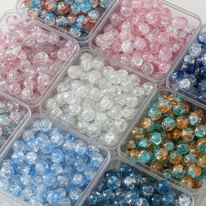 Close-up of 10mm cracked glass beads in various colors for DIY jewelry making