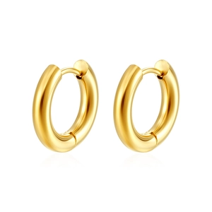 Close-up of classic polished golden stainless steel hoop earrings on a white background