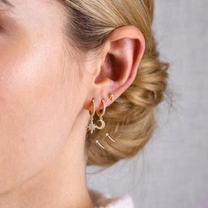 S925 Sterling Silver Star and Moon Gold Hoop Earrings set shown on ear model