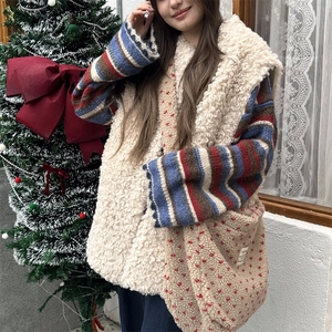 Plush lamb wool vest with striped sweater and matching red polka dot crossbody bag