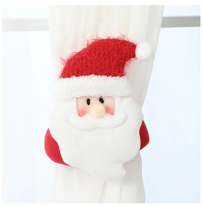 Detail of Santa Claus plush curtain tieback showing velvet texture and secure fastening