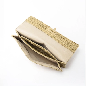 Women's woven straw clutch bag with golden turn-lock closure and dual compartments