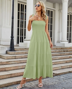 Detail of light green backless tiered maxi dress with ruched waist and layered skirt
