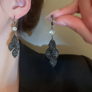 Macro shot of black crystal tassel earrings with micro-set zircon on silver needles