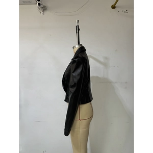 Side profile of a black PU leather jacket featuring long sleeves and zipper detailing