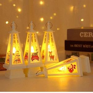 Set of 4 Christmas LED lanterns with festive Santa and snowman illustrations in warm light