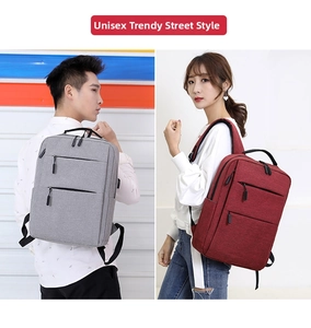 Business laptop backpack with USB charging port shown in grey and burgundy colors