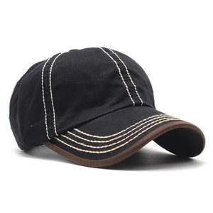 Detail view of cotton baseball cap with contrast stitching and anchor emblem embroidery