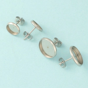 Detailed view of silver stainless steel round stud earring blanks for DIY jewelry making