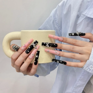 Long pink and black handmade press-on nails with silver stars and crystal rhinestone charms