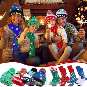 Close-up of LED knitted Christmas hat and scarf set with festive reindeer patterns