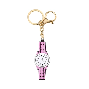 Pink cartoon watch pendant keychain with gold metal ring and lobster clasp on white background