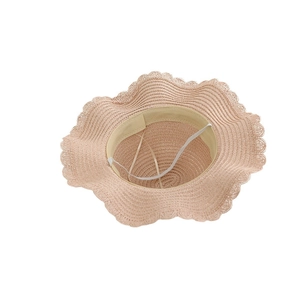 Pink straw sun hat for girls with wide wavy brim and elastic chin strap detail