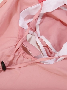 Detail of pink sun hat featuring white breathable mesh lining and adjustable drawstring cord