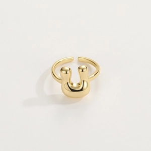 Macro view of adjustable 18K gold plated open ring with smooth U-shape design detail