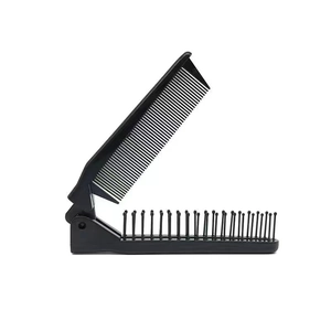 Detail of a foldable black plastic child's comb featuring dual-purpose teeth and hinges