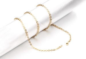 Detailed view of a gold-plated stainless steel cable chain with a secure lobster clasp
