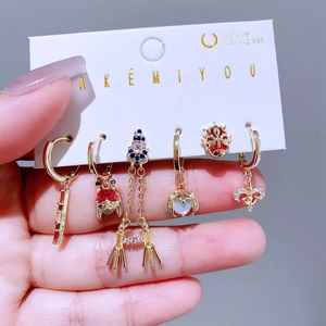 Close-up of a 6-piece earring set featuring colorful zircons and creative fashion motifs