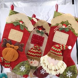 Three Christmas stockings with 3D Santa Snowman and Reindeer characters for holiday decor