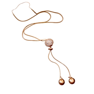 Rose gold tassel necklace with zircon paved sphere and snake chains on white background