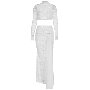 Detail of white lace two-piece set featuring sheer cropped top and ruched high-waist skirt