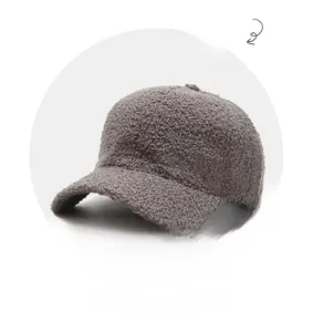 Close-up of dark grey lamb wool texture on a thick warm baseball cap detail