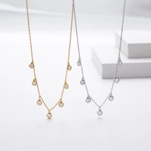 Detailed view of S925 silver necklaces with seven round-cut cubic zirconia stones on thin chains