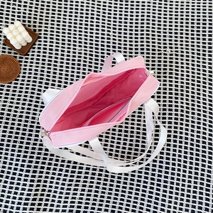 Top view of pink heart ita bag showing inner pocket and spacious interior storage