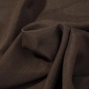 Close-up of dark brown fabric showing detailed cross-weave texture and premium linen-like quality