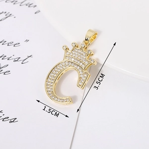 Macro view of gold-plated crown letter G pendant with cubic zirconia, size 1.5x3.5cm