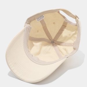 Detail view of cotton baseball cap interior with 100% cotton label and neat stitching