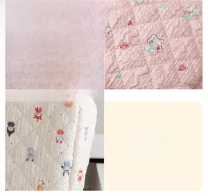 Detail of quilted floral cosmetic bag showing soft fabric texture and fine diamond stitching