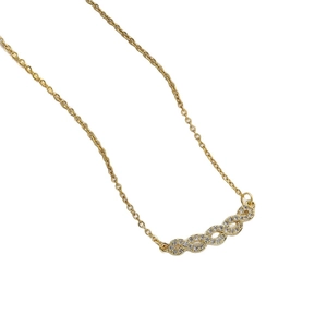 Elegant gold titanium steel heart necklace with sparkling diamonds on a white background