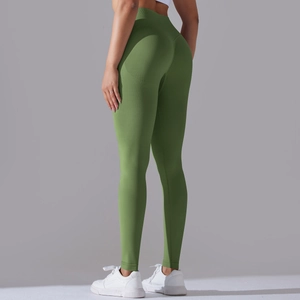 Close-up of olive green seamless yoga pants showing ribbed texture and high-waist cut