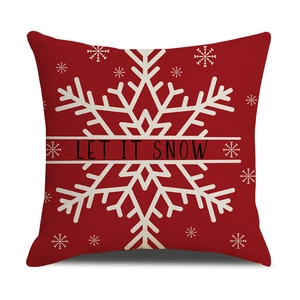 Red Christmas linen pillow cover with white Let It Snow text and snowflake pattern