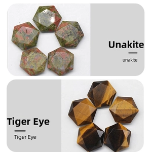 Detail view of hex-cut Unakite and Tiger Eye crystals with faceted natural stone surfaces