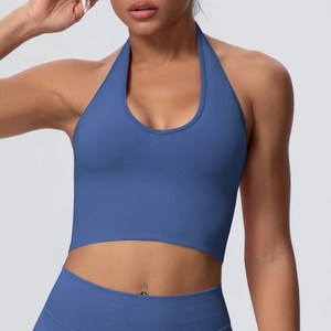Detail of hazy blue halter yoga bra showing ribbed knit texture and V-neckline fit