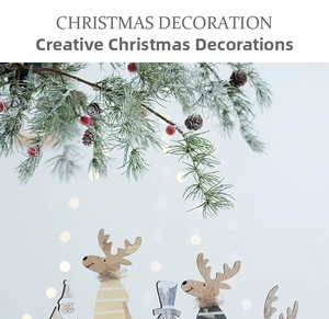 Detailed view of wooden Christmas reindeer figurines with pine branches and bokeh lights