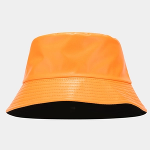 Detail of glossy orange PU leather bucket hat showing reinforced stitching and texture