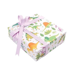 Cartoon dinosaur gift wrapping paper with light purple ribbon for kids birthday parties