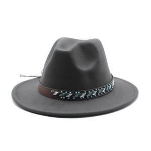 Detail of dark grey wool felt fedora with ethnic beaded brown leather band