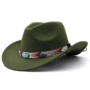 Detailed close-up of ethnic patterned band with turquoise stones on dark green wool fedora
