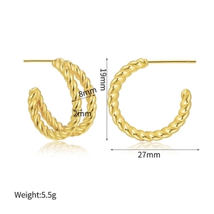 Detail view of gold C-shape twisted earrings with dimensions 19mm by 27mm and 8mm thickness