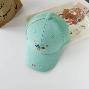 Close-up of kids mesh baseball cap featuring cute whale embroidery and breathable mesh back