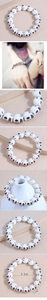 Macro detail of skull-shaped beaded bracelet with 1.2cm white and brown resin beads