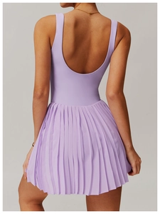 Detail of purple tennis dress featuring a backless U-neck design and pleated skirt hem
