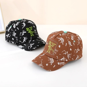 Detail of dinosaur print on cotton baseball caps for kids with green bone embroidery
